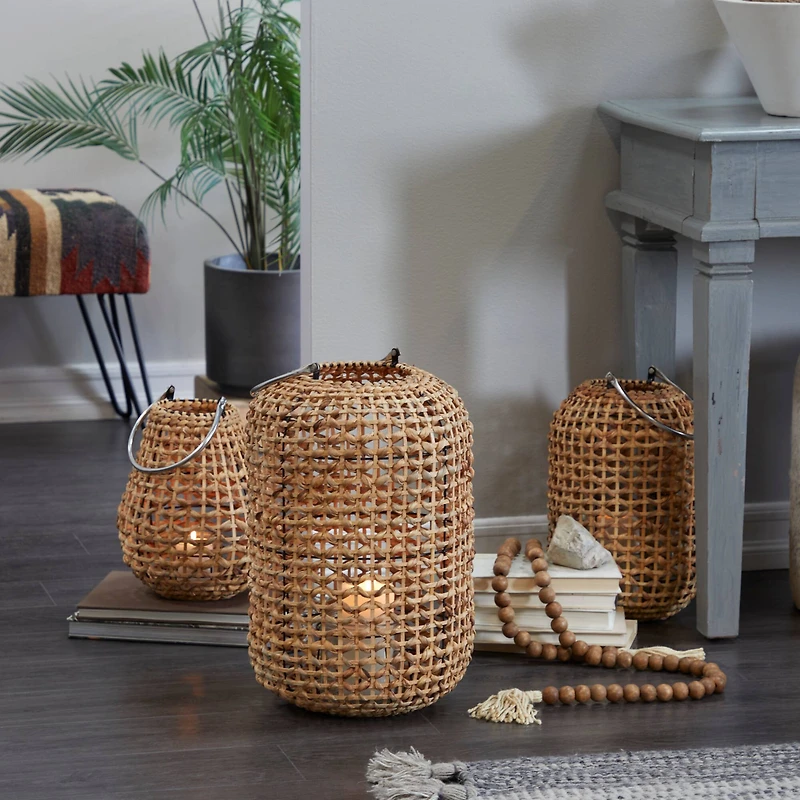 The Novogratz 19" Brown Metal Handmade Candle Lantern with Glass Holder and Handle