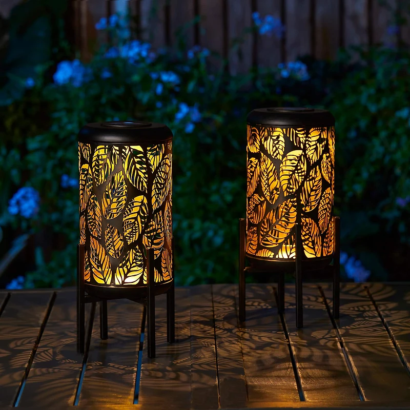 Glitzhome® 14.25" Black Metal Cutout Leaves Pattern Solar Powered LED Outdoor Lantern, 2ct.