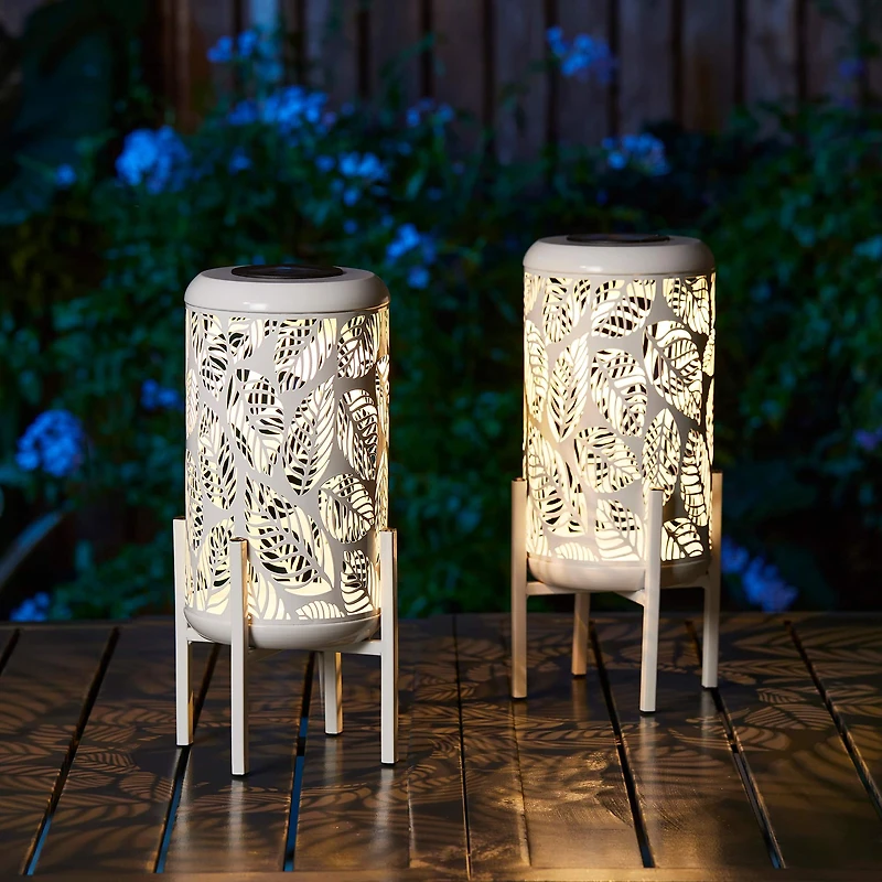 Glitzhome® 14.25" White Metal Cutout Leaves Pattern Solar Powered LED Outdoor Lanterns, 2ct.