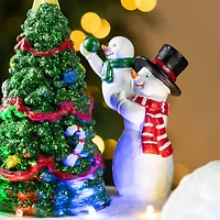 Glitzhome® 20" Lighted Christmas Santa Train Resin Village with Movement and Music