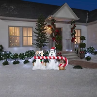5.5ft. Airblown® Inflatable Christmas Puppies with Big Candy Cane