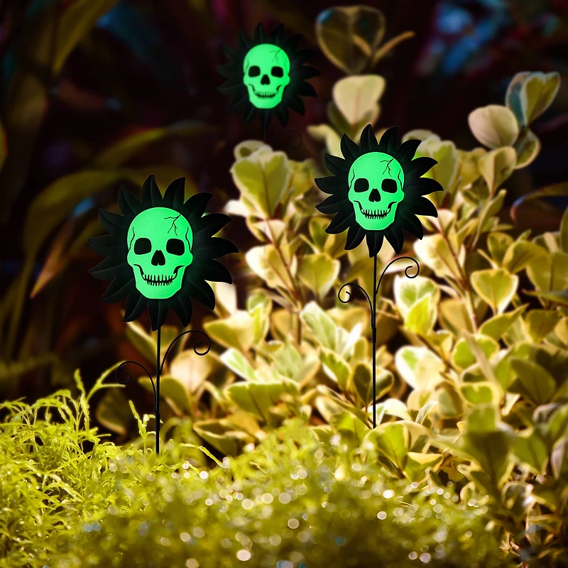 Glitzhome® 24" Halloween Metal Sunflower Skulls Glow-in-Dark Yard Stakes, 3ct.