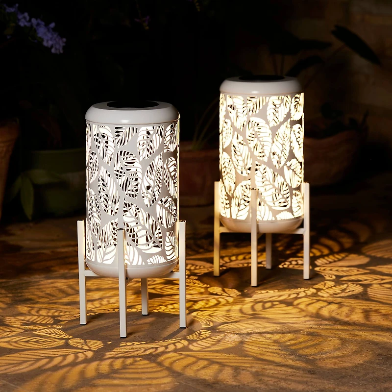 Glitzhome® 14.25" White Metal Cutout Leaves Pattern Solar Powered LED Outdoor Lanterns, 2ct.