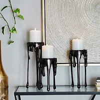 CosmoLiving by Cosmopolitan Black Aluminum Pillar Candle Holder with Dripping Melting Designed Legs Set