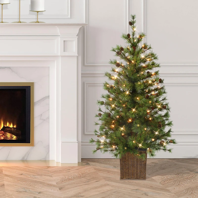 4ft. Pre-Lit Spruce Artificial Potted Christmas Tree in Rattan Base, Clear Lights