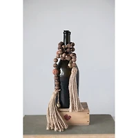 Hello Honey® 40" Paulownia Wood Beads, Jingle Bells & Jute Tassels Garland