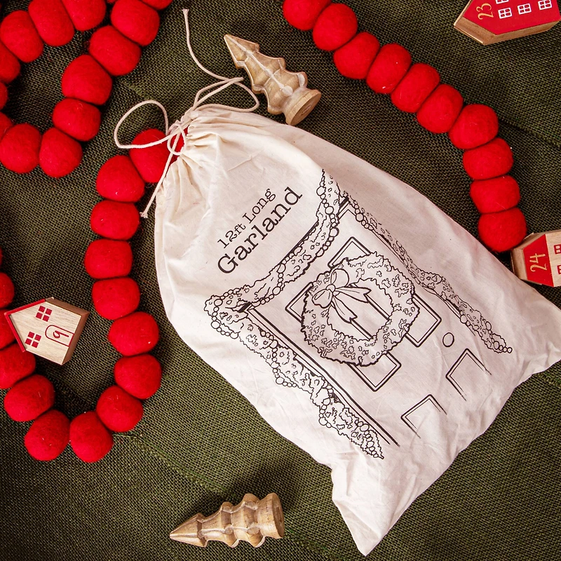 Hello Honey® 12ft. Handmade Wool Felt Ball Garland in Printed Drawstring Bag