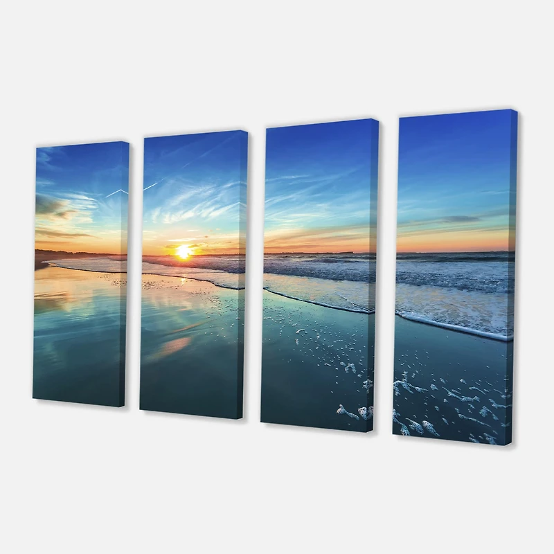 Designart - Blue Seashore with Distant Sunset