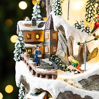 Glitzhome® 15.5" Lighted Christmas Skiing Moutain Resin Village with Movement and Music