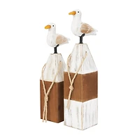 Brown Bird Sculpture with White Distressed Buoy Posts Set