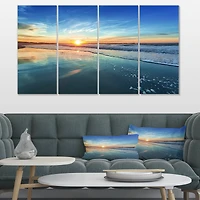 Designart - Blue Seashore with Distant Sunset