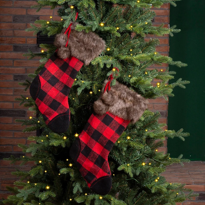 Glitzhome® 21" Black & Red Buffalo Plaid Pompom Stockings, 2ct.