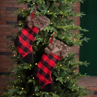 Glitzhome® 21" Black & Red Buffalo Plaid Pompom Stockings, 2ct.