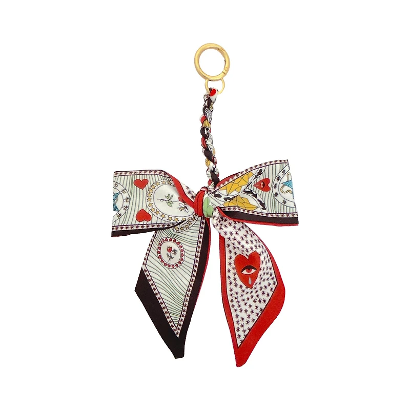 Blue Moon Studio™ Red Hearts & Bees Print Bow Bag Charm