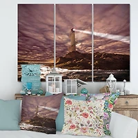 Designart - Lighthouse Shining Light During Stormy Night I