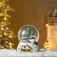 Glitzhome® 8" Lighted Musical Snowflakes Village Waterglobe