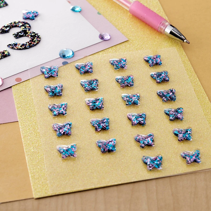 12 Packs: 24 ct. (288 total) Blue & Pink Iridescent Butterfly Bling Stickers by Recollections™