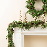 Glitzhome® 6ft Christmas Greenery PE Cedar Garland with Red Berries, 2ct.
