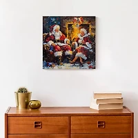 Santa and Mrs. Claus Cozy Fire 12" x 12" Canvas Wall Art