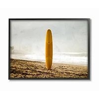 Stupell Industries Yellow Surfboard in Sand Framed Wall Art