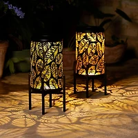 Glitzhome® 14.25" Black Metal Cutout Leaves Pattern Solar Powered LED Outdoor Lantern, 2ct.