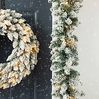 Glitzhome® 6ft. Pre-Lit Snow Flocked Christmas Garland, 2ct.
