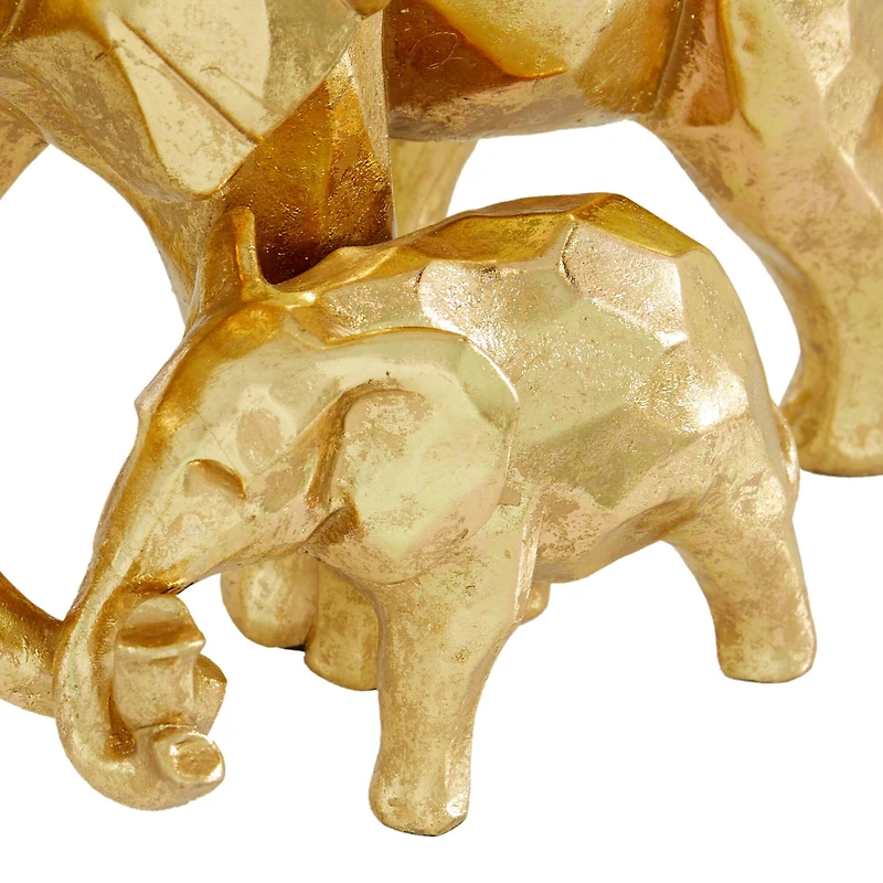 CosmoLiving by Cosmopolitan 10" Gold Modern Elephant Sculpture
