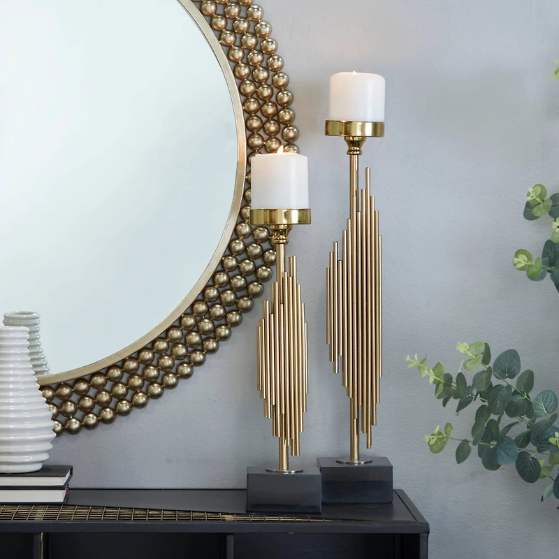 The Novogratz Gold Stainless Steel Vertical Pipe Stand Candle Holder Set