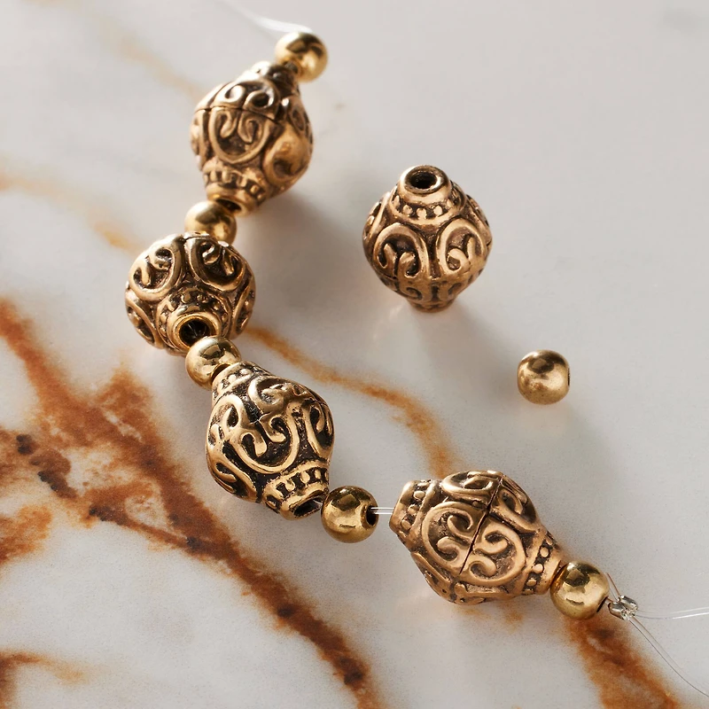 Antique Gold Metal Bicone Beads by Bead Landing™