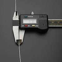 The Beadsmith® Opelon® 0.7mm White Stretch Jewelry Fiber