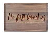 He First Loved Us 17" x 11" Walnut Cutting Board