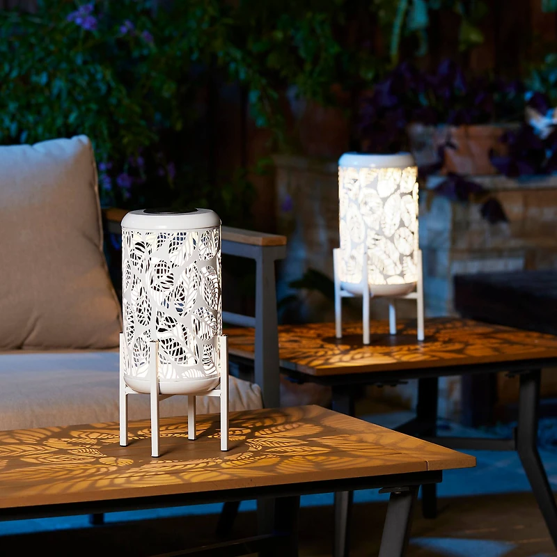 Glitzhome® 14.25" White Metal Cutout Leaves Pattern Solar Powered LED Outdoor Lanterns, 2ct.