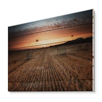 Designart - Landscape With A Field Full of Hay Bales At Sunset - Farmhouse Print on Natural Pine Wood
