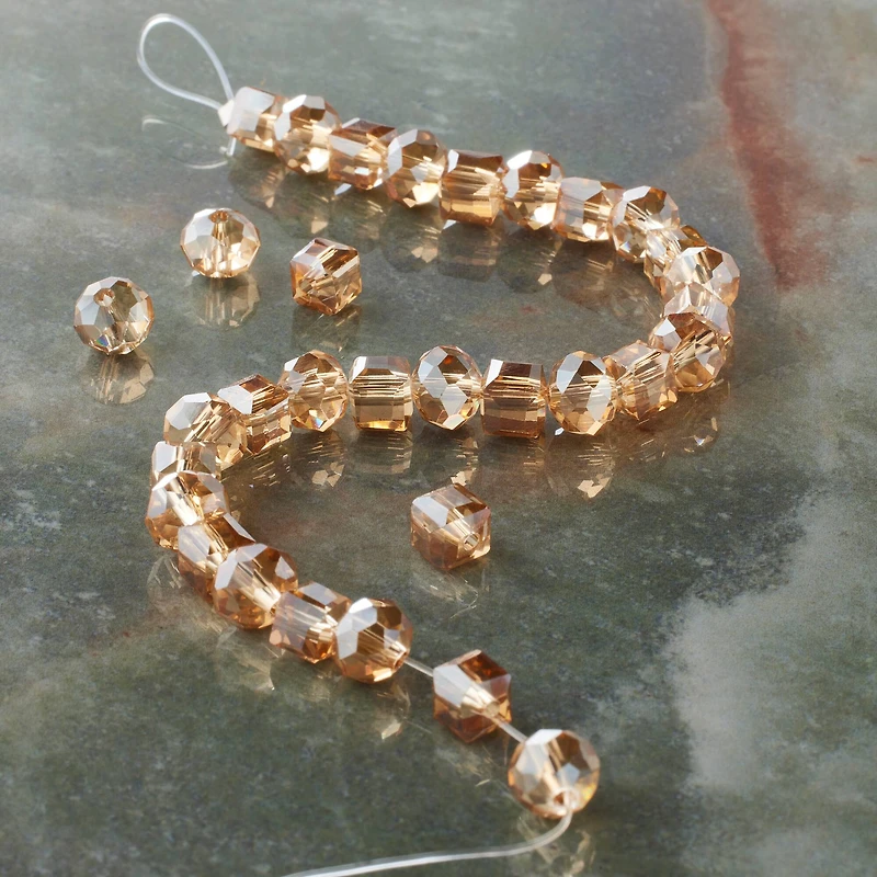 12 Pack: Amber Faceted Glass Cube & Rondelle Beads, 6mm by Bead Landing™