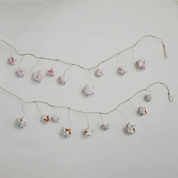 Hello Honey® 6 ft. Printed Paper Star with Woodland Flora & Fauna Pattern Garlands Set