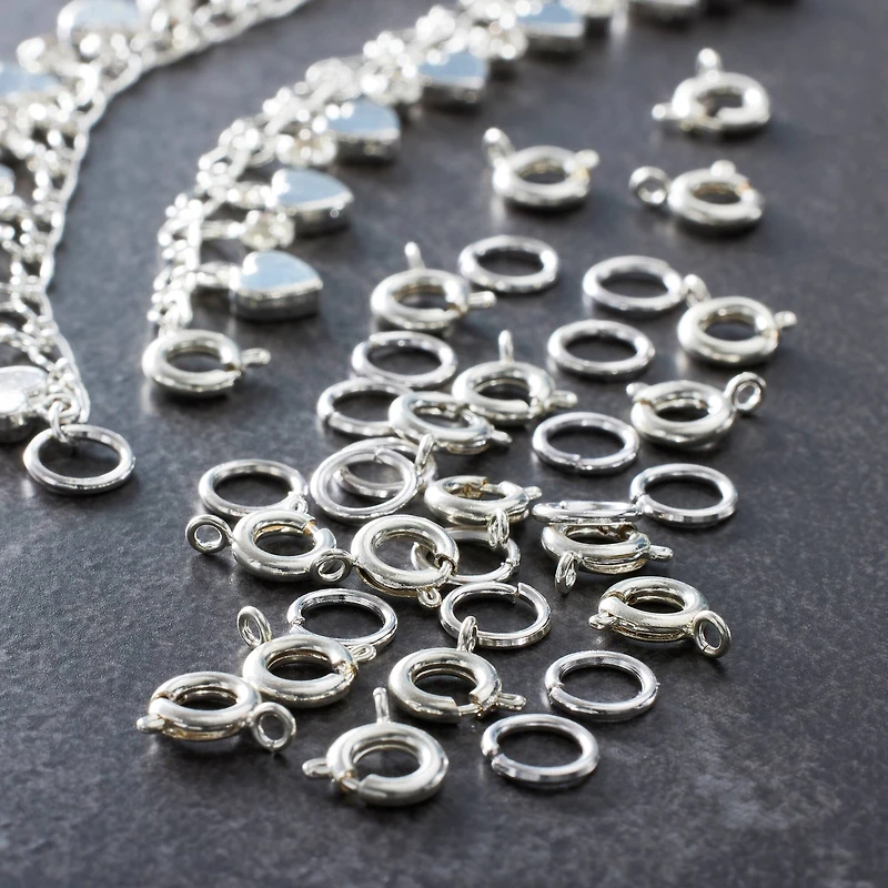 12 Packs: 36 ct. (432 total) 7mm Silver Spring Ring Clasps by Bead Landing™