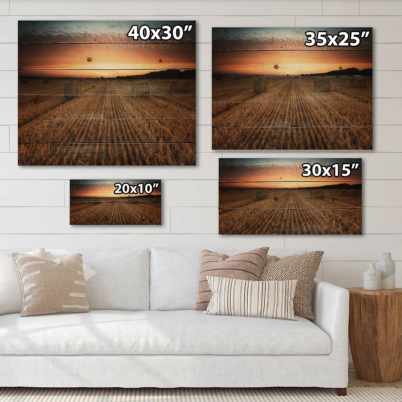 Designart - Landscape With A Field Full of Hay Bales At Sunset - Farmhouse Print on Natural Pine Wood