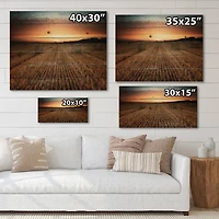 Designart - Landscape With A Field Full of Hay Bales At Sunset - Farmhouse Print on Natural Pine Wood