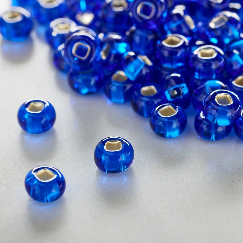 12 Pack: John Bead Sapphire Silver Lined Czech Glass Seed Beads, 6/0