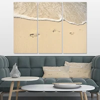 Designart - Footprints in Sand on the Beach