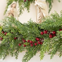 Glitzhome® 6ft Christmas Greenery PE Cedar Garland with Red Berries, 2ct.