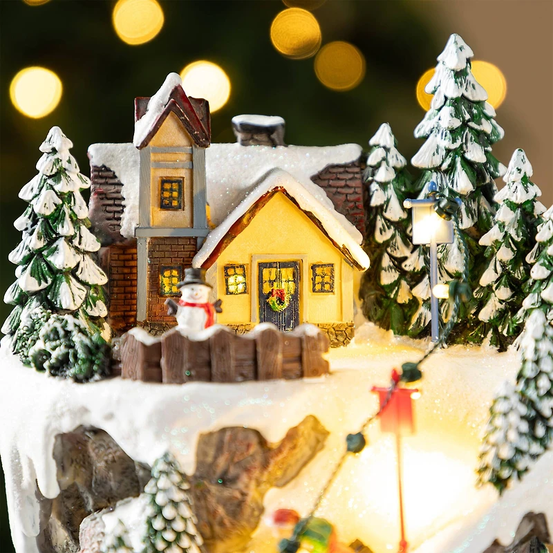 Glitzhome® 15.5" Lighted Christmas Skiing Moutain Resin Village with Movement and Music