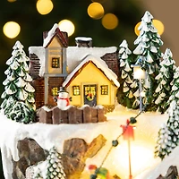 Glitzhome® 15.5" Lighted Christmas Skiing Moutain Resin Village with Movement and Music