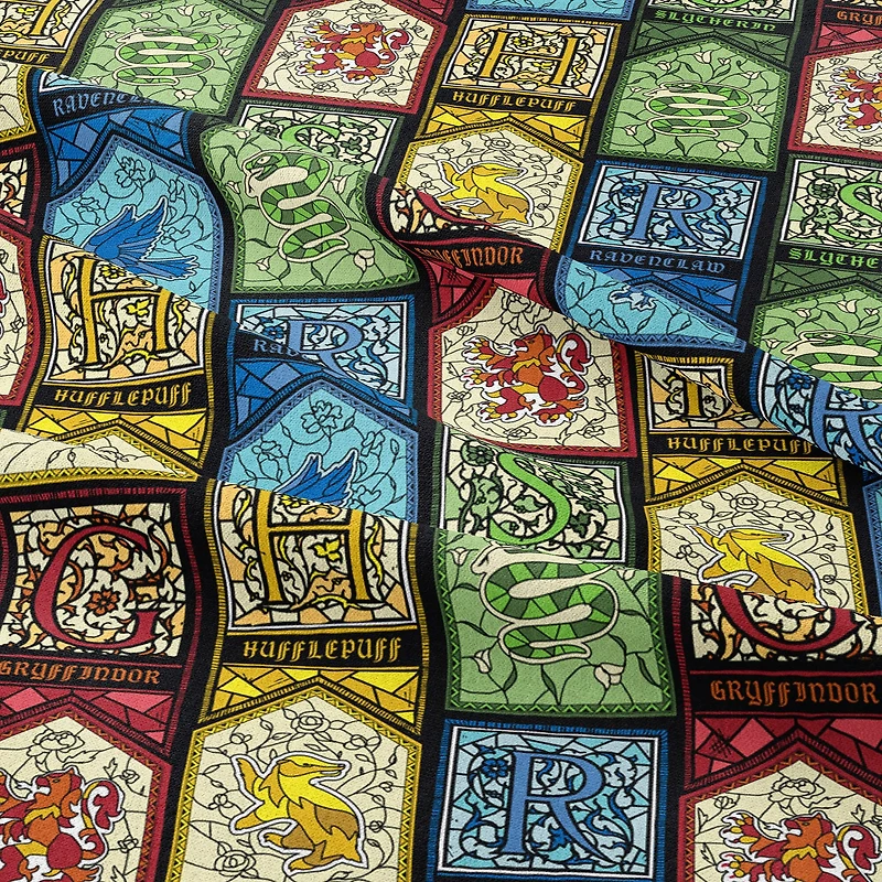 Harry Potter™ Stained Glass Houses Cotton Fabric