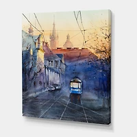 Designart - Blue Tram At Sunset With Church During Sunset