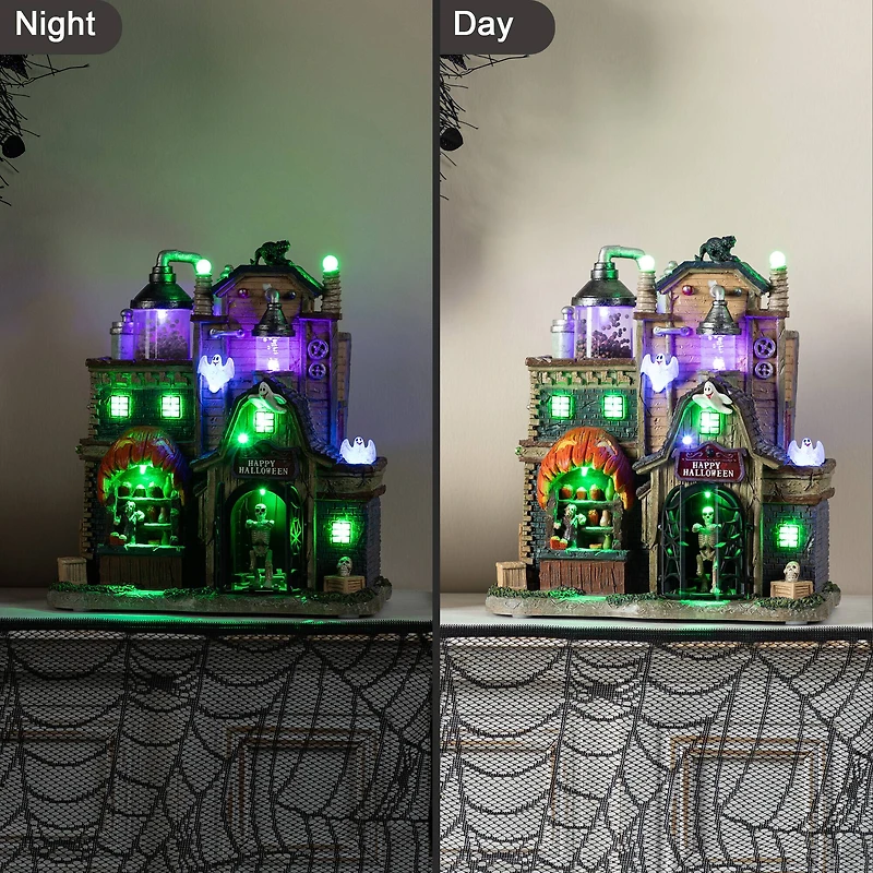 Glitzhome® 11"H Lighted Resin Halloween Haunted House Village