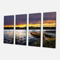 Designart - Boat Docked in Lake at Sunset