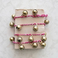 Hello Honey® 6ft. Gold Finish Metal Bells on Braided Red & White Cord Garland