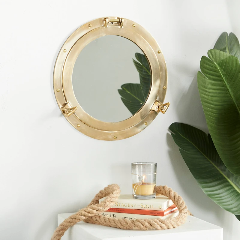 The Novogratz Gold Brass Sail Boat Wall Mirror with Port Hole Detailing 15" x 3" x 15"