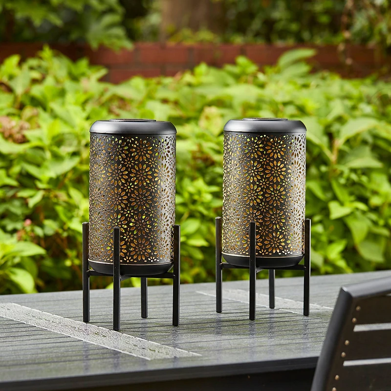 Glitzhome® 14.25" Black Metal Cutout Flower Pattern Solar Powered LED Outdoor Lanterns, 2ct.